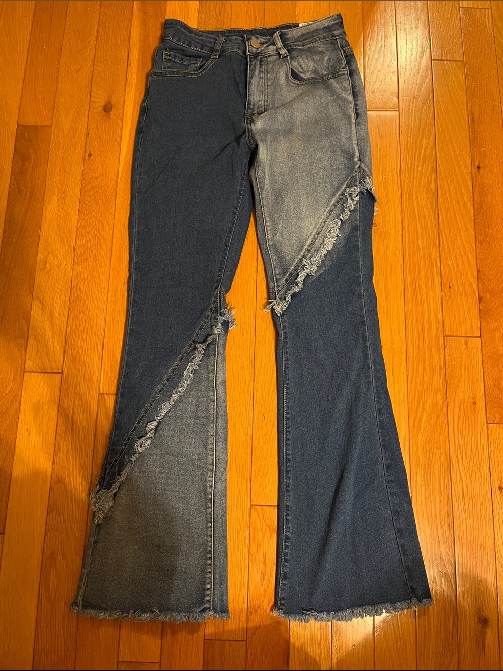 Two-tone distressed flare jeans
